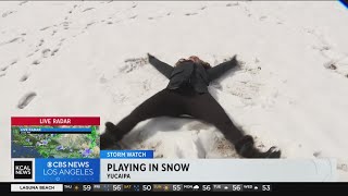 Kids, adults play in the snow after Yucaipa cancels classes