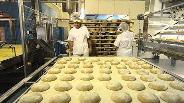 Kornfeil - Automatic deck oven line for bread production - Manual loading on loading table.