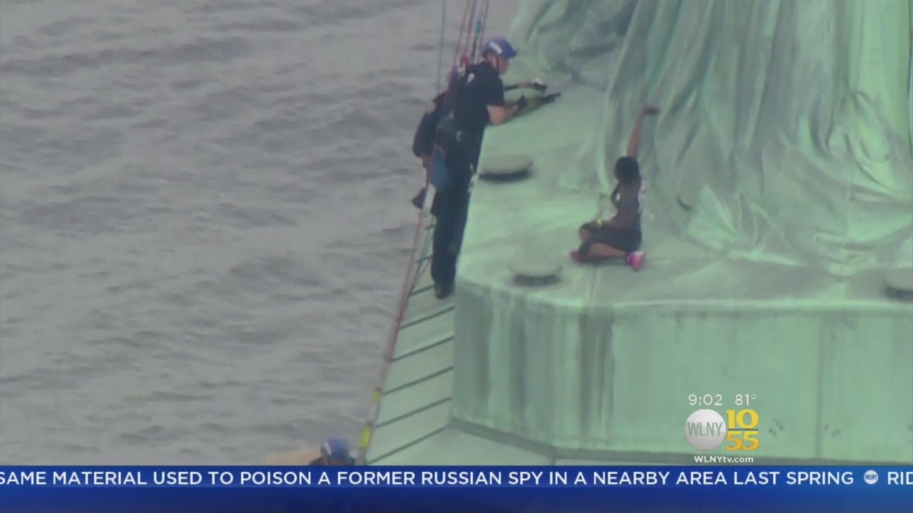 Woman In Custody After Scaling The Statue Of Liberty - YouTube