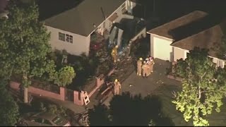 1 dead, 8 injured after car crashes into house