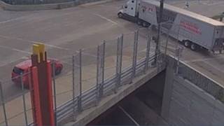 Crash Leaves Semi Dangling From Overpass