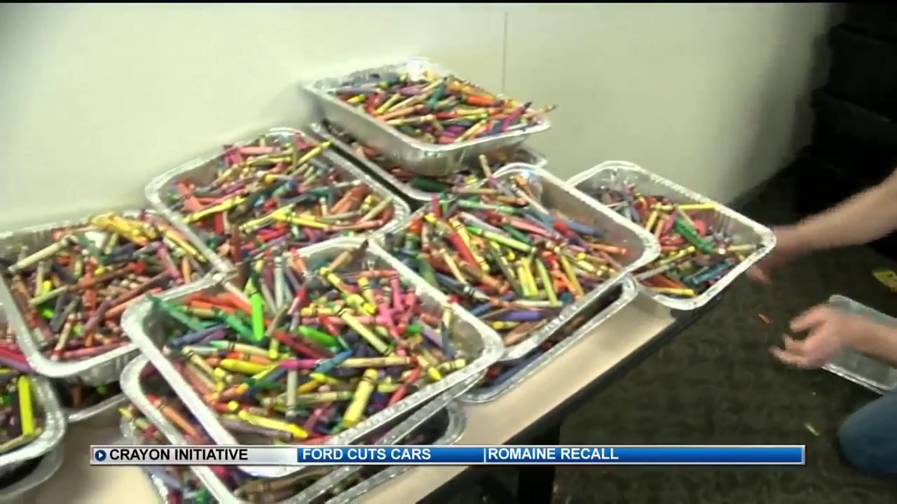 Employees volunteer to sort crayons used for children in hospitals