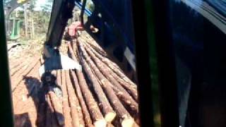 John Deere 2154 loading logs