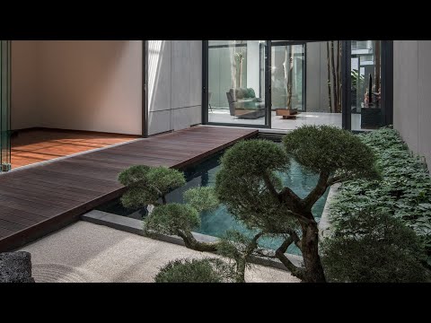 Videó: Zen-inspirált lakóépület egy erőteljes modern építészeti geometriával: 66MRN ház