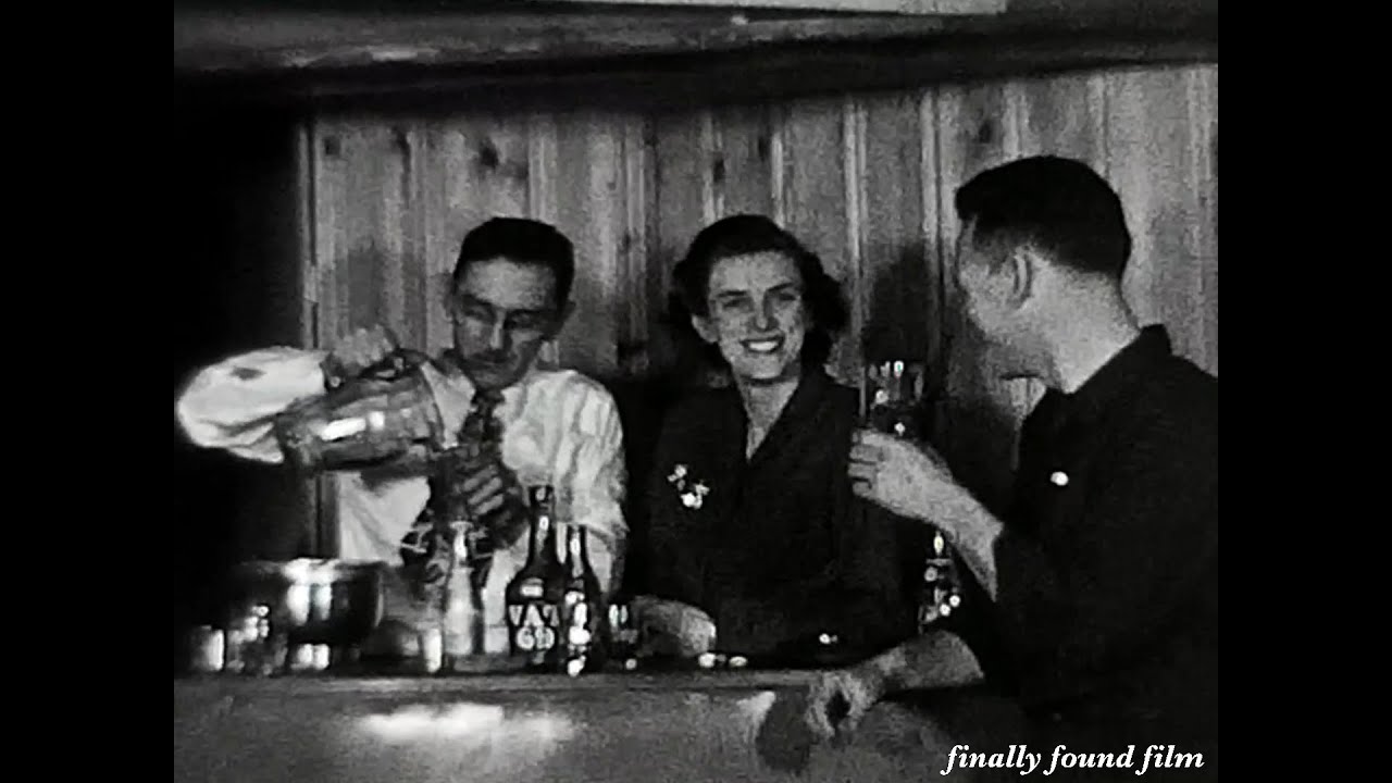 Vintage 1940s New Year's Eve party 8mm found home movie clip basement bar drinking dancing kissing