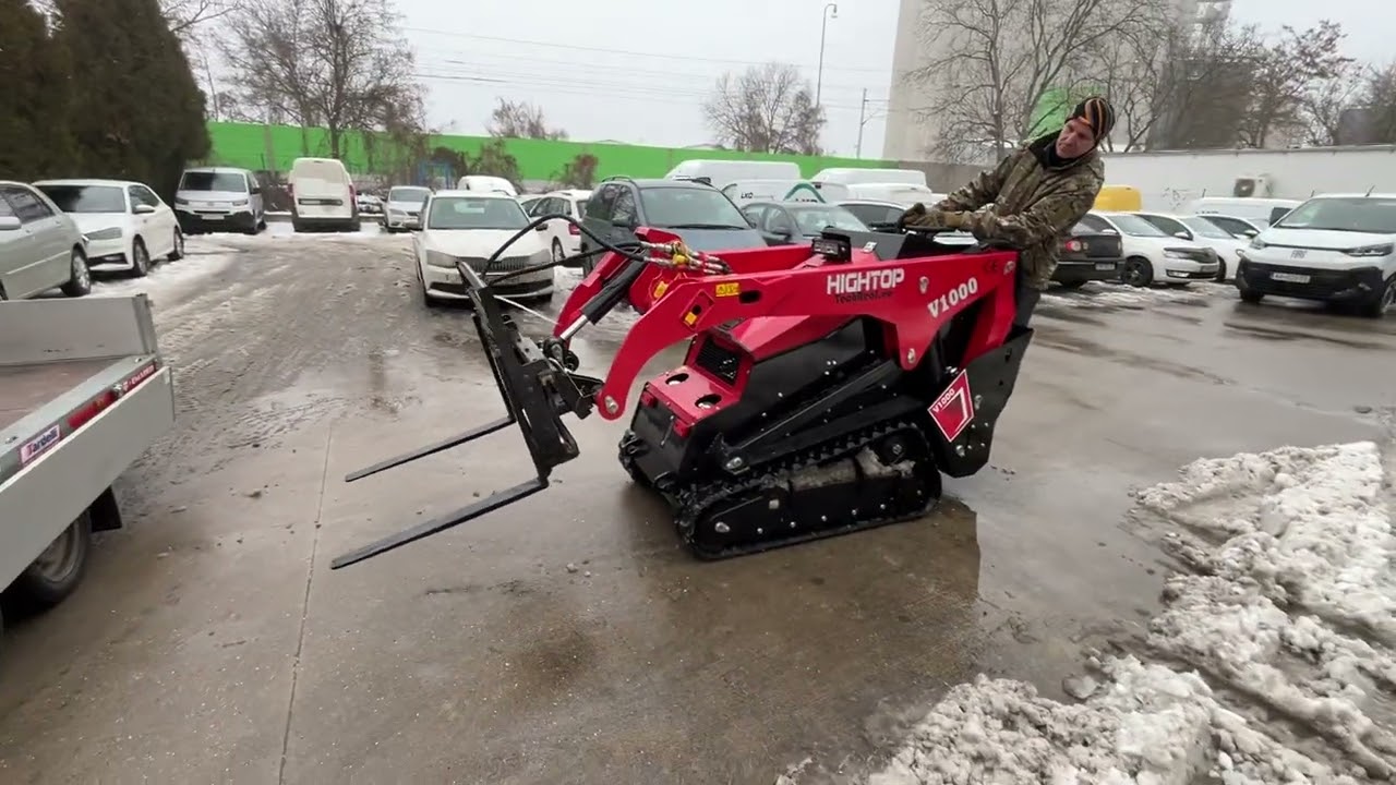 Šmykom riadený pásový nakladač HTV1000 náklad 700kg