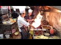 The Heat of the Indo-Chinese Wok Master's Kitchen on a Very Busy Saturday Night in Indian Restaurant