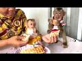Happy family!! Mom smiles as she watches her two children, LIORA and TORO, enjoy coconut waffles
