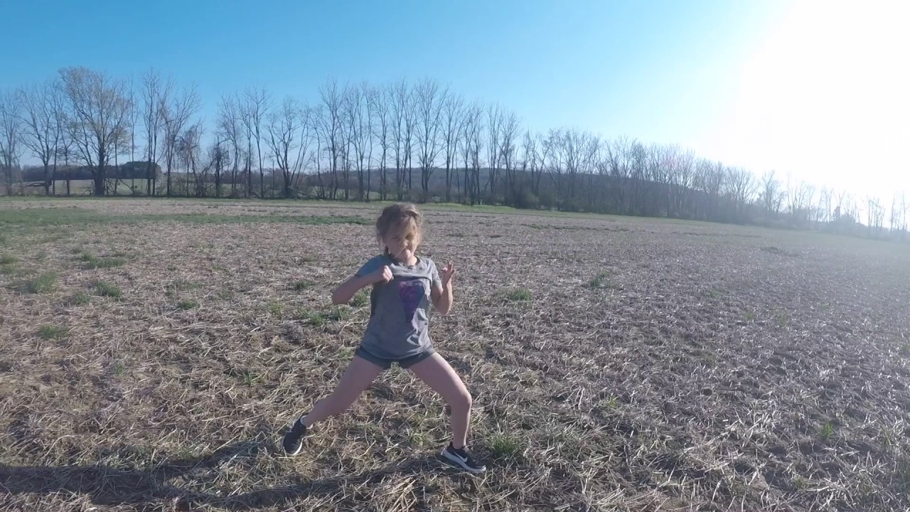 Channah training outdoors - Girl Practices Bo and Karate Skills Outside