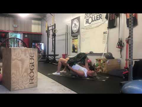 Sandbag Hip Bridge Lift + Chop
