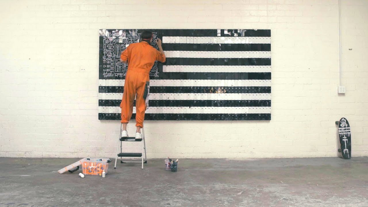 Artist Chris Sharp tiles smashed iPhones into a 10 foot American Flag.
