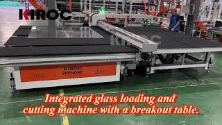 Integrated glass loading and cutting machine with a breakout table.