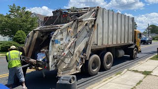 Two Peterbilt 320 Leach 2Rll Garbage Trucks on Wednesday Routes