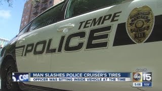 Man arrested after slashing tire on Tempe police car