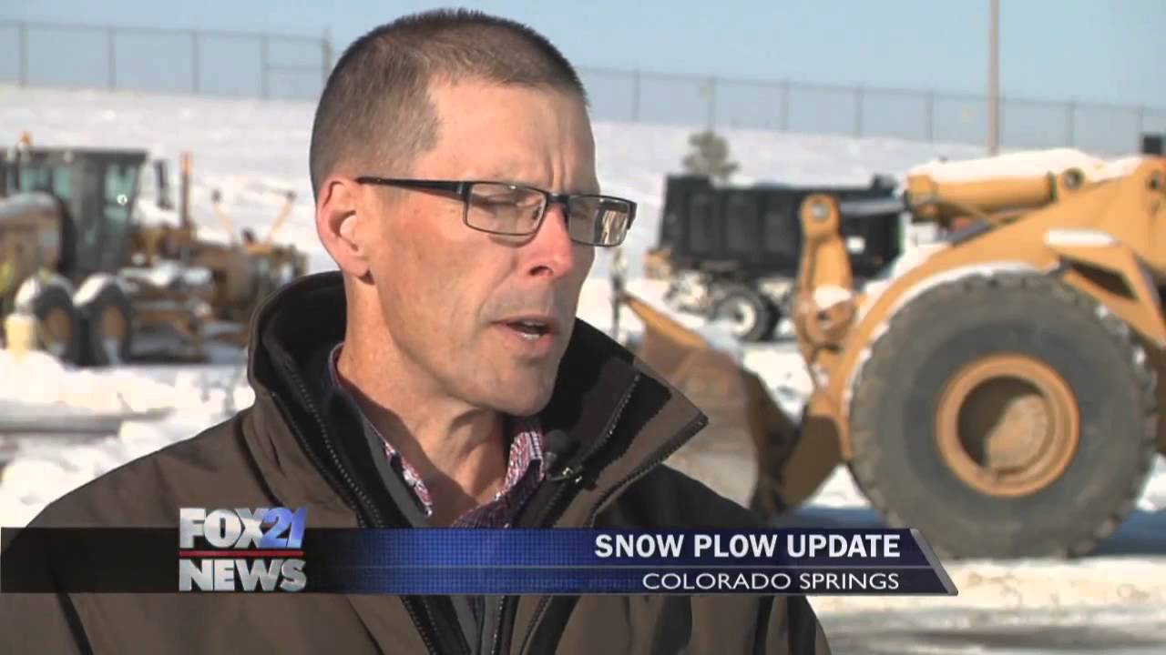 Snow plow drivers working on clearing off roads for morning commute