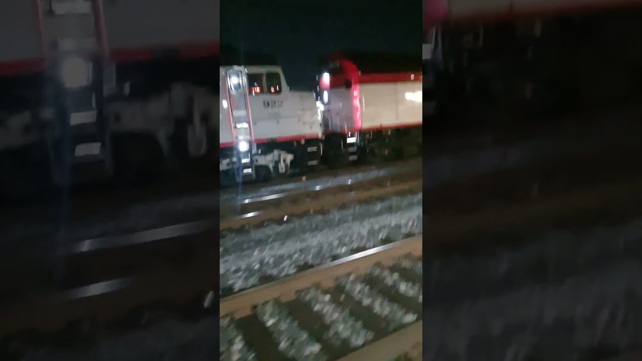 Caltrain Diesel Locomotives idling in Santa Ckara Station attached to Funeral Cars.