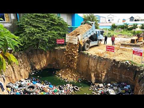Amazing bulldozer operators and smart truck drivers cleverly clean up a trash-filled pond.