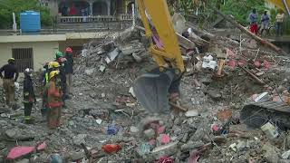 LIVE: Haitians scramble to rescue survivors from ruins of quake