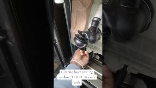 CLR FLTR error on a Haier washer?Your drain filter is blocked — clean it before it damages the pump.
