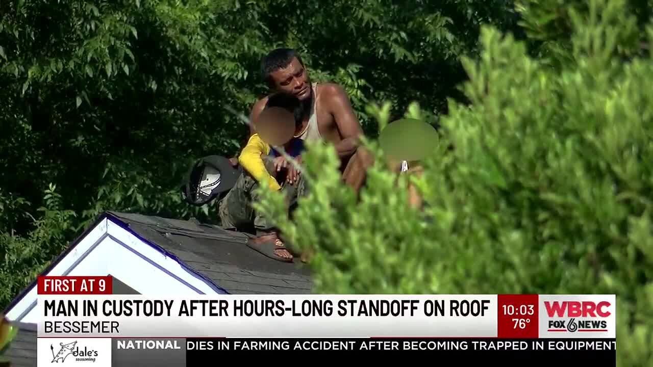 Man in custody after hours-long standoff on roof - YouTube