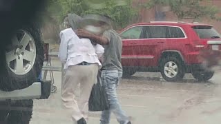 Photo of teen shielding elderly woman from rain with jacket goes viral