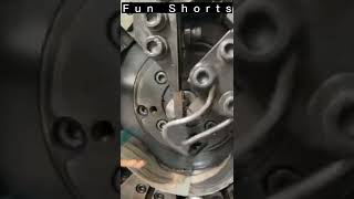 Making of safety pin at factory by heavy machine.