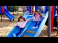 Chloe and meghan playing at the outdoor playground for kids