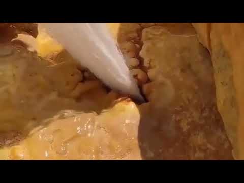 و إ ن م ن ه ا ل م ا ي ش ق ق ف ي خ ر ج م ن ه ال م اء