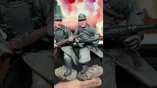 Army Men painting WWII German Infantry in long coats