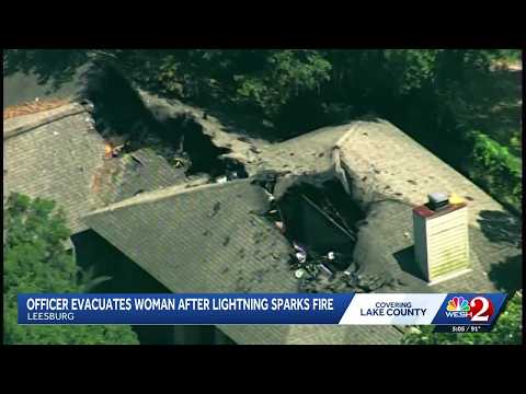 Officer evacuates woman after lightning sparks fire in Leesburg