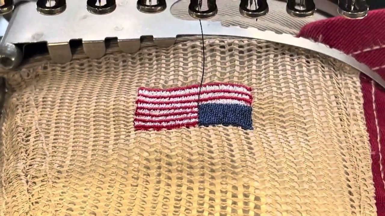 Embroidery - American Flag on the side of a trucker hat.