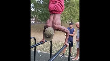 Hitting the handstand on the parallel bars, with a handstand push up & bar transfer