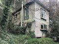 Abandoned Decaying House in the mountains With power.