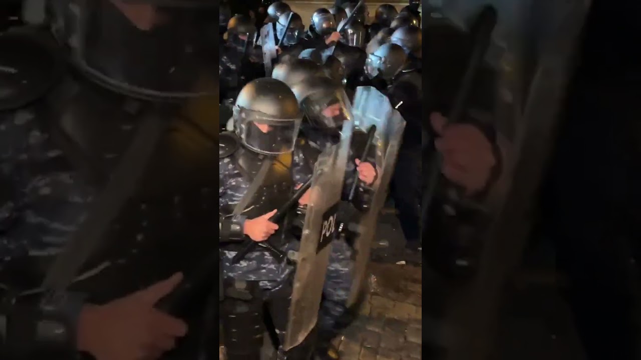 Riot police and Georgian pro-EU protesters playing a game with each other.  
