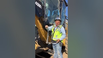 Loading a 140M Grader on a lowboy