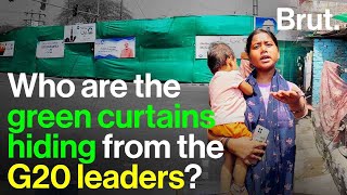 Who are the green curtains hiding from the G20 leaders?