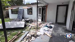 Mercedes crashes into Sunrise home, injuring woman