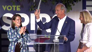 Mobile Mayor Sandy Stimpson passes the baton — literally — to Spiro Cheriogotis