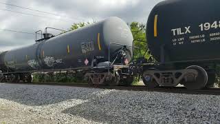 CSX K empty ethanol train going through Bell Buckle Tn with a CN Dash 9 in trail and gates mess up