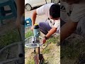 Handheld spiral ground anchor installation drill
