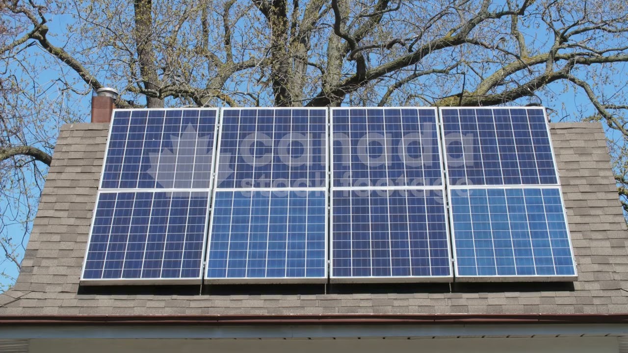 Solar panels on roof of suburban house stock video. Toronto, Ontario, Canada. 4K Royalty Free.