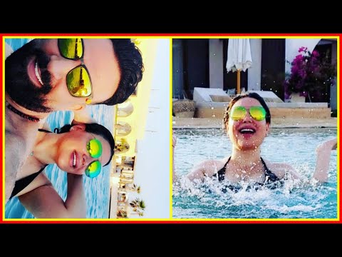 عبير صبرى تستمتع بالصيف فى حمام السباحة بالمايوه برفقة زوجها