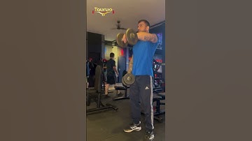 Elevação frontal unilateral com halteres