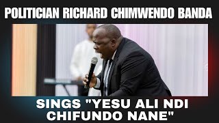 Politician Richard Chimwendo Banda sings 'Yesu Ali ndi Chifundo nane' in church.