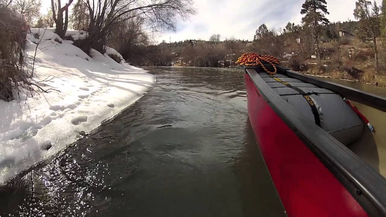 Winter canoeing on the Animas river in a Mad River Freedom Solo canoe