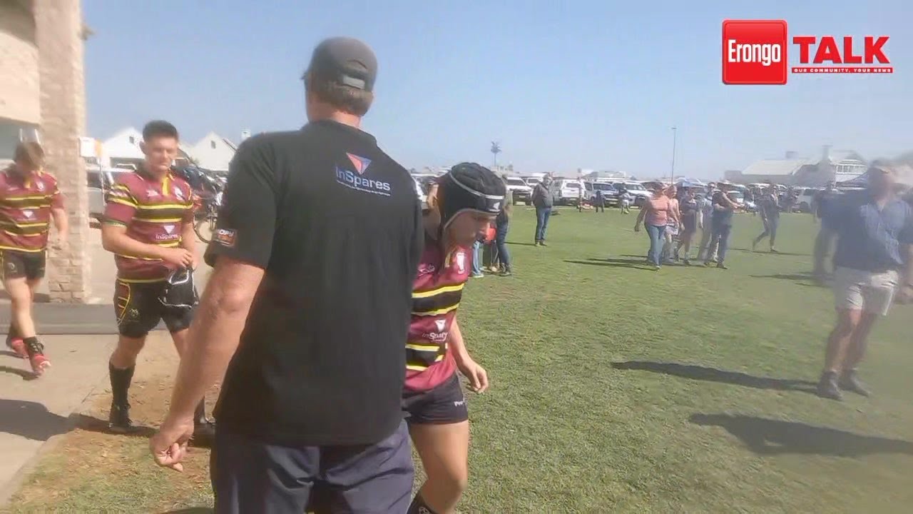 CHARGED... The first teams of Pro-Ed Academy and Moria Private School run onto the field, met with