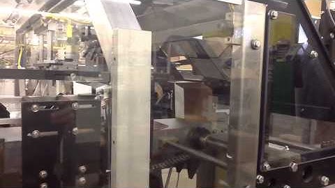 Spartan with automated motion & bucket conveyor for reverse tuck carton