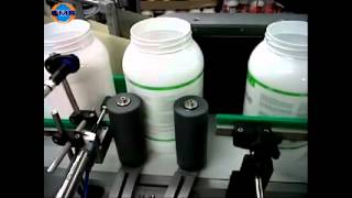 Labeling system for wraparound application on CYLINDRICAL CONTAINERS.avi