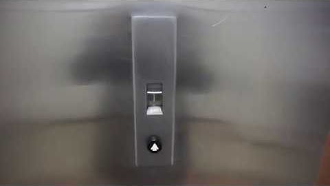 Old Otis traction elevator with rotating cylinder floor indicator in Oak Park Illinois