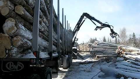 Prentice loading logs in New Brunswick